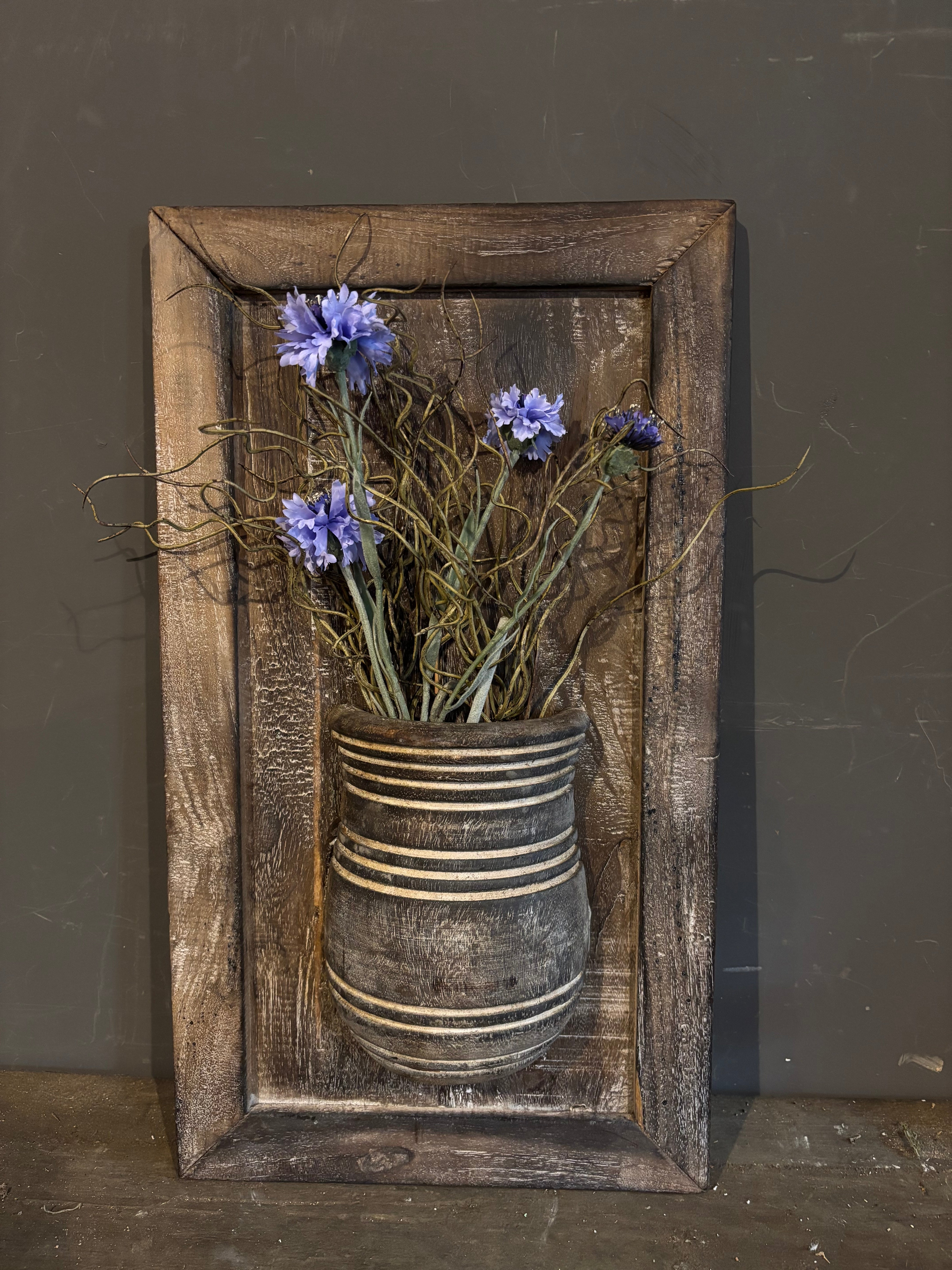 Houten paneel met pot